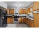Well-equipped kitchen with ample cabinet space, a stainless steel oven and sink at 3211 Deerfield Dr, Tampa, FL 33619