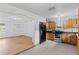 Open kitchen with wooden cabinets, modern appliances, and easy access to the living area at 3211 Deerfield Dr, Tampa, FL 33619