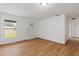 Bright living room featuring hardwood floors, a window, and a front door at 3211 Deerfield Dr, Tampa, FL 33619