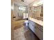 Bathroom featuring a shower tub, toilet, and a vanity sink with tile floors at 3224 Aspen Ter, Sarasota, FL 34237
