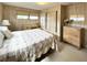 Relaxing bedroom featuring a comfortable queen size bed, ample storage space, and natural light at 3224 Aspen Ter, Sarasota, FL 34237
