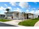 Inviting home with a covered carport, well-kept lawn, and charming exterior details, perfect for comfortable living at 3224 Aspen Ter, Sarasota, FL 34237