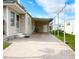 Spacious covered patio area adjacent to a well-maintained home, offering ample space for outdoor entertaining and relaxation at 3224 Aspen Ter, Sarasota, FL 34237
