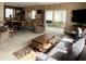 Cozy living room featuring comfortable seating, a view to the sunroom, and a warm inviting atmosphere at 3224 Aspen Ter, Sarasota, FL 34237