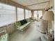 Sunroom with lots of natural light, multiple seating areas, and carpeted floors at 3224 Aspen Ter, Sarasota, FL 34237