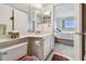 Well-maintained bathroom featuring vanity, mirror, and toilet with door open to bedroom at 3680 Ironwood Circle # 704-L, Bradenton, FL 34209