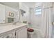 A clean bathroom with a white tub, shower, and vanity offers essential functionality at 3680 Ironwood Circle # 704-L, Bradenton, FL 34209