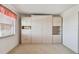 Bright bedroom features a large window and ample built-in storage with light-colored wooden cabinets at 3680 Ironwood Circle # 704-L, Bradenton, FL 34209