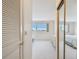 Bright bedroom with natural light, neutral carpet, and closet storage at 3680 Ironwood Circle # 704-L, Bradenton, FL 34209