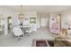 Spacious dining area adjacent to living space and entryway, bathed in natural light at 3680 Ironwood Circle # 704-L, Bradenton, FL 34209