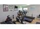 Well-equipped exercise room featuring treadmills, rowing machine, and motivational artwork at 3680 Ironwood Circle # 704-L, Bradenton, FL 34209