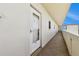Exterior view of condo entrance with white door and tile floors at 3680 Ironwood Circle # 704-L, Bradenton, FL 34209