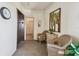 Inviting hall features elevator access and comfortable seating next to decorative palm tree art at 3680 Ironwood Circle # 704-L, Bradenton, FL 34209