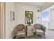 Inviting hall features elevator access and comfortable seating next to decorative palm tree art at 3680 Ironwood Circle # 704-L, Bradenton, FL 34209