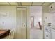 Corner featuring a closet, table and view into the living room through arched entryway at 3680 Ironwood Circle # 704-L, Bradenton, FL 34209