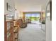 Bright living room with large windows offering scenic views and comfortable seating arrangement at 3680 Ironwood Circle # 704-L, Bradenton, FL 34209