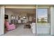 View from the screened balcony into the living room and dining area at 3680 Ironwood Circle # 704-L, Bradenton, FL 34209
