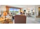 Bright living room with large windows, comfortable seating, and elegant dining area at 3680 Ironwood Circle # 704-L, Bradenton, FL 34209