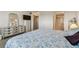 Well-lit main bedroom showing ensuite bathroom, closet, and dresser at 3680 Ironwood Circle # 704-L, Bradenton, FL 34209