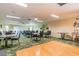 Large meeting room with decorative carpet, ceiling fans, and plenty of seating at tables at 3680 Ironwood Circle # 704-L, Bradenton, FL 34209