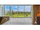 Balcony with scenic golf course views and comfortable seating area at 3680 Ironwood Circle # 704-L, Bradenton, FL 34209