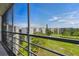 Spacious screened balcony with golf course view and balcony railing at 3680 Ironwood Circle # 704-L, Bradenton, FL 34209