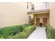 Close up of a front entrance featuring dual doors, landscaping, and a walkway at 3698 Parkridge Cir # 26-104, Sarasota, FL 34243