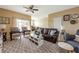 Living room with a ceiling fan, leather sofa, modern furniture at 3698 Parkridge Cir # 26-104, Sarasota, FL 34243