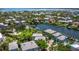Expansive aerial view of waterfront homes featuring lush landscaping, private docks, and direct access to the bay at 3959 Somerset Dr # 5, Sarasota, FL 34242