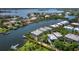 Panoramic aerial view of waterfront homes with private boat docks, beautiful landscaping, and bay access at 3959 Somerset Dr # 5, Sarasota, FL 34242