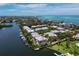 Aerial view of coastal homes with lush landscaping, private docks, and access to the bay waters at 3959 Somerset Dr # 5, Sarasota, FL 34242