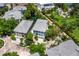 Aerial view showcasing luxury homes in a lush community, featuring manicured lawns and tropical foliage at 3959 Somerset Dr # 5, Sarasota, FL 34242