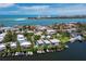 Stunning aerial view of a waterfront property with boat docks in a picturesque coastal community with ocean view at 3959 Somerset Dr # 5, Sarasota, FL 34242