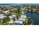 Aerial view showcases waterfront homes along canal with private docks, lush landscaping, and access to the bay at 3959 Somerset Dr # 5, Sarasota, FL 34242