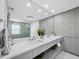 Modern bathroom boasts double sinks, vanity with storage, and a large mirror at 3959 Somerset Dr # 5, Sarasota, FL 34242