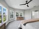 Spacious primary bedroom with natural light from bay windows and neutral decor at 3959 Somerset Dr # 5, Sarasota, FL 34242