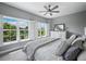 Light and airy bedroom with views of neighborhood from large windows and a comfortable bed at 3959 Somerset Dr # 5, Sarasota, FL 34242