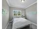 Cozy bedroom features natural light, a bed, and nautical themed decor at 3959 Somerset Dr # 5, Sarasota, FL 34242