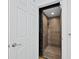 Accessible elevator with wood paneling for in-home convenience at 3959 Somerset Dr # 5, Sarasota, FL 34242