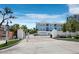 Gated community entrance with manicured landscaping offers privacy and security at 3959 Somerset Dr # 5, Sarasota, FL 34242