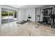 Bright exercise room featuring sliding glass doors and workout equipment at 3959 Somerset Dr # 5, Sarasota, FL 34242