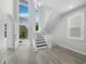 Bright foyer features a staircase, soaring ceilings, and views to the outdoors at 3959 Somerset Dr # 5, Sarasota, FL 34242