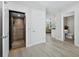 Inviting hallway showcasing access to an elevator, and views into the rest of the home at 3959 Somerset Dr # 5, Sarasota, FL 34242