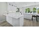 Beautiful kitchen with an island and seating, plenty of prep space, and lots of natural light at 3959 Somerset Dr # 5, Sarasota, FL 34242