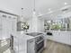 Open-concept kitchen featuring stainless steel appliances and a view into the adjacent living area at 3959 Somerset Dr # 5, Sarasota, FL 34242