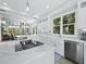 Modern kitchen with a large island, stainless steel appliances, and ample counter space at 3959 Somerset Dr # 5, Sarasota, FL 34242