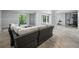 Open-concept living room with modern furnishings and sliding glass doors at 3959 Somerset Dr # 5, Sarasota, FL 34242