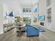 Expansive living room boasts soaring ceilings, fireplace, and custom accents at 3959 Somerset Dr # 5, Sarasota, FL 34242