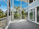 Spacious screened lanai offering scenic outdoor living and views of lush greenery at 3959 Somerset Dr # 5, Sarasota, FL 34242