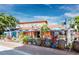 Quaint restaurant exterior with outdoor seating, blue umbrellas, and colorful decor, perfect for dining at 3959 Somerset Dr # 5, Sarasota, FL 34242